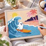 Creating handmade ghost surfing at beach punch needle artwork