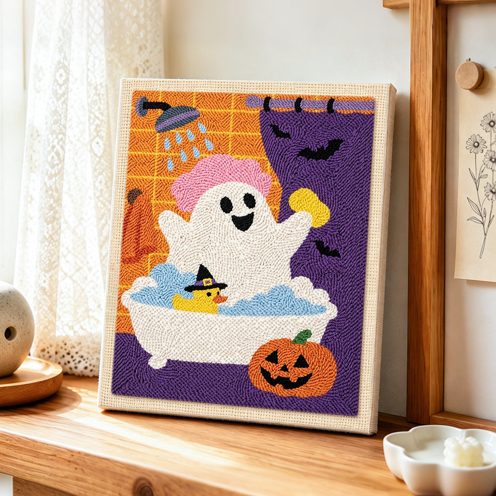 Ghost taking bubble bath punch needle artwork displayed on a table