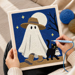 Creating handmade ghost walking with cat punch needle artwork