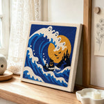 Ghost wave ocean scene punch needle artwork displayed on a table