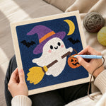 Creating handmade ghost witch on broom punch needle artwork