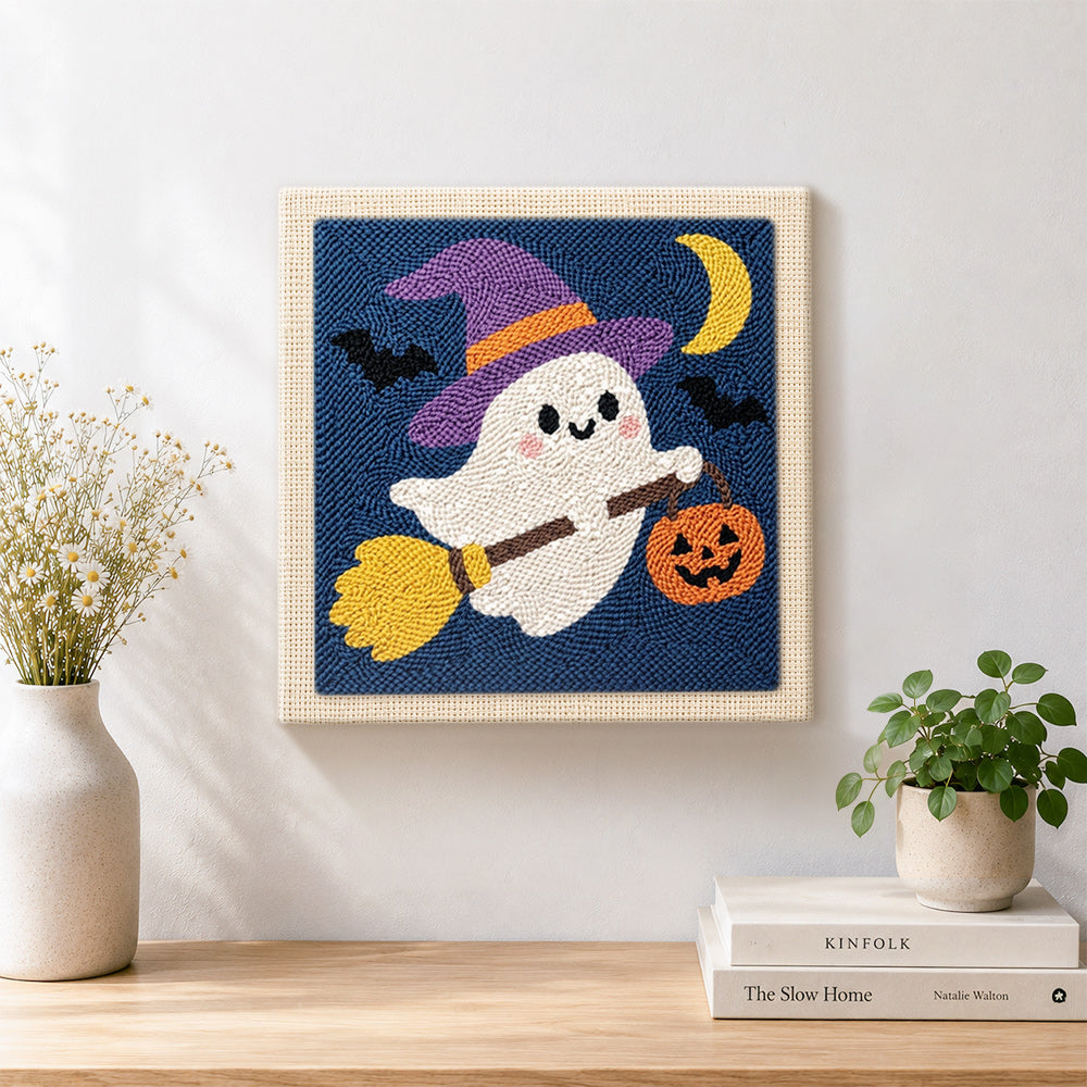 Finished ghost witch on broom artwork displayed on a wall