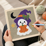 Creating handmade ghost witch with pumpkin lantern punch needle artwork