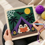 Creating handmade ghosts camping reading punch needle artwork