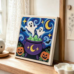 Ghosts in magic cauldron punch needle artwork displayed on a table