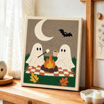 Ghosts toasting marshmallows punch needle artwork displayed on a table