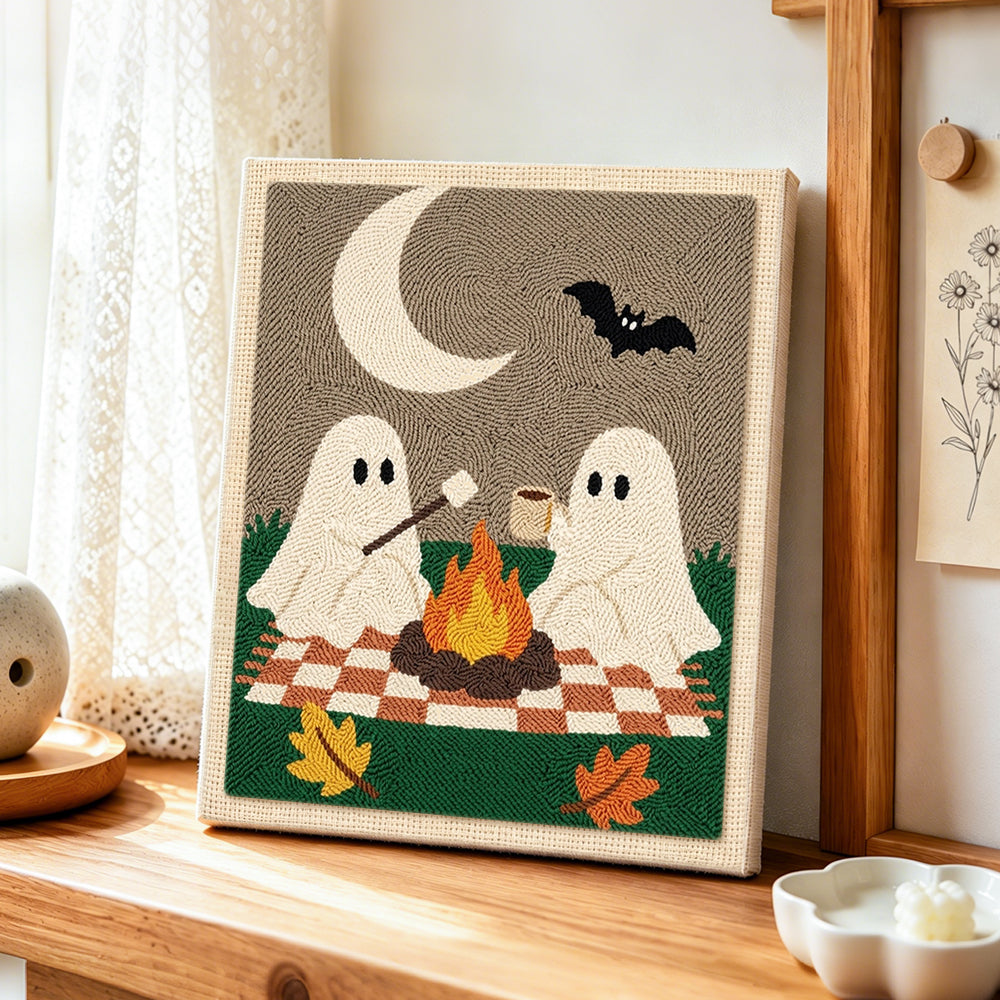 Ghosts toasting marshmallows punch needle artwork displayed on a table