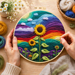 Creating the giant sunflower on rainbow hills wool painting by hand with a felting needle