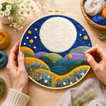 Creating the giant white moon over colorful flower hills wool painting by hand with a felting needle