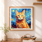 Finished ginger cat in starry night art cross stitch artwork displayed as home decor