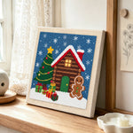 Gingerbread man cabin punch needle artwork displayed on a table