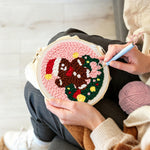 Creating handmade gingerbread man in wreath unch needle artwork