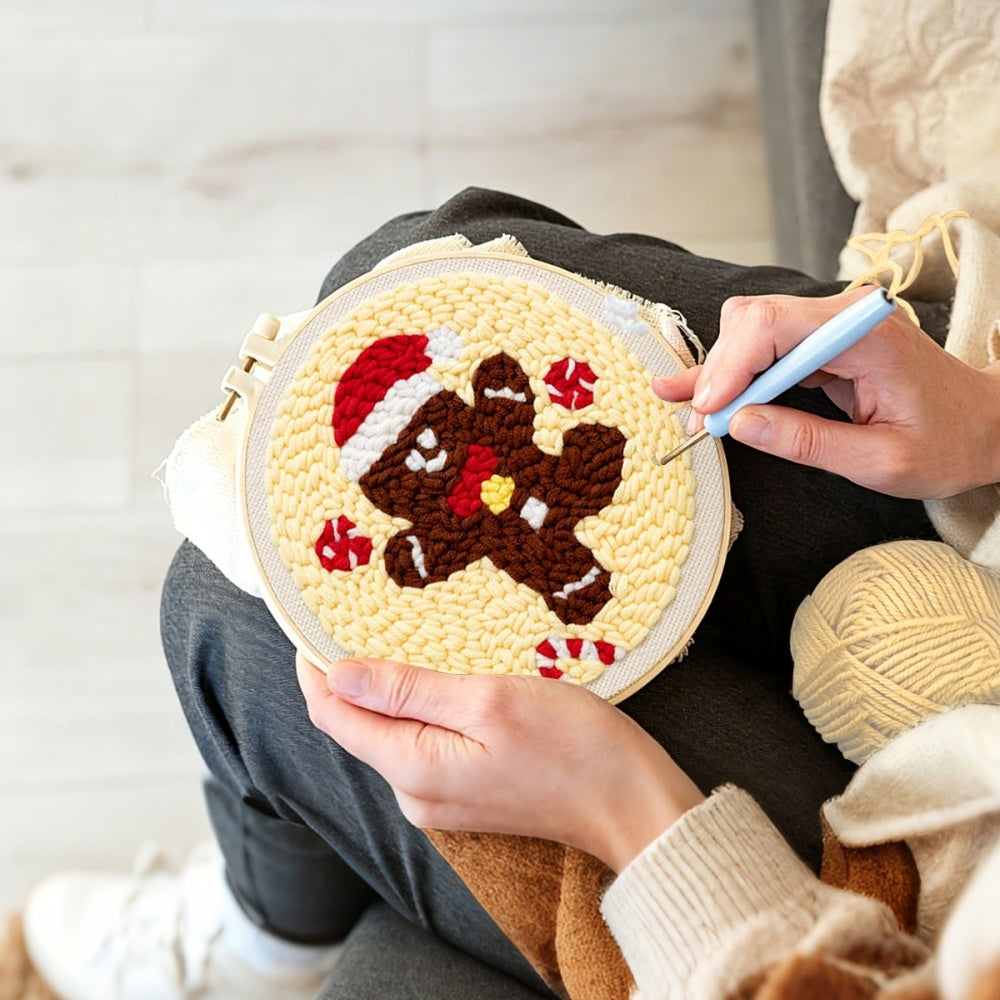 Creating handmade gingerbread man with santa hat unch needle artwork