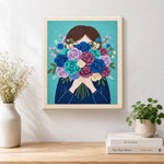 Finished girl with romantic flower bunch artwork displayed on a wall