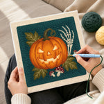 Creating handmade glowing jack o lantern punch needle artwork