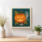 Finished glowing jack o lantern artwork displayed on a wall