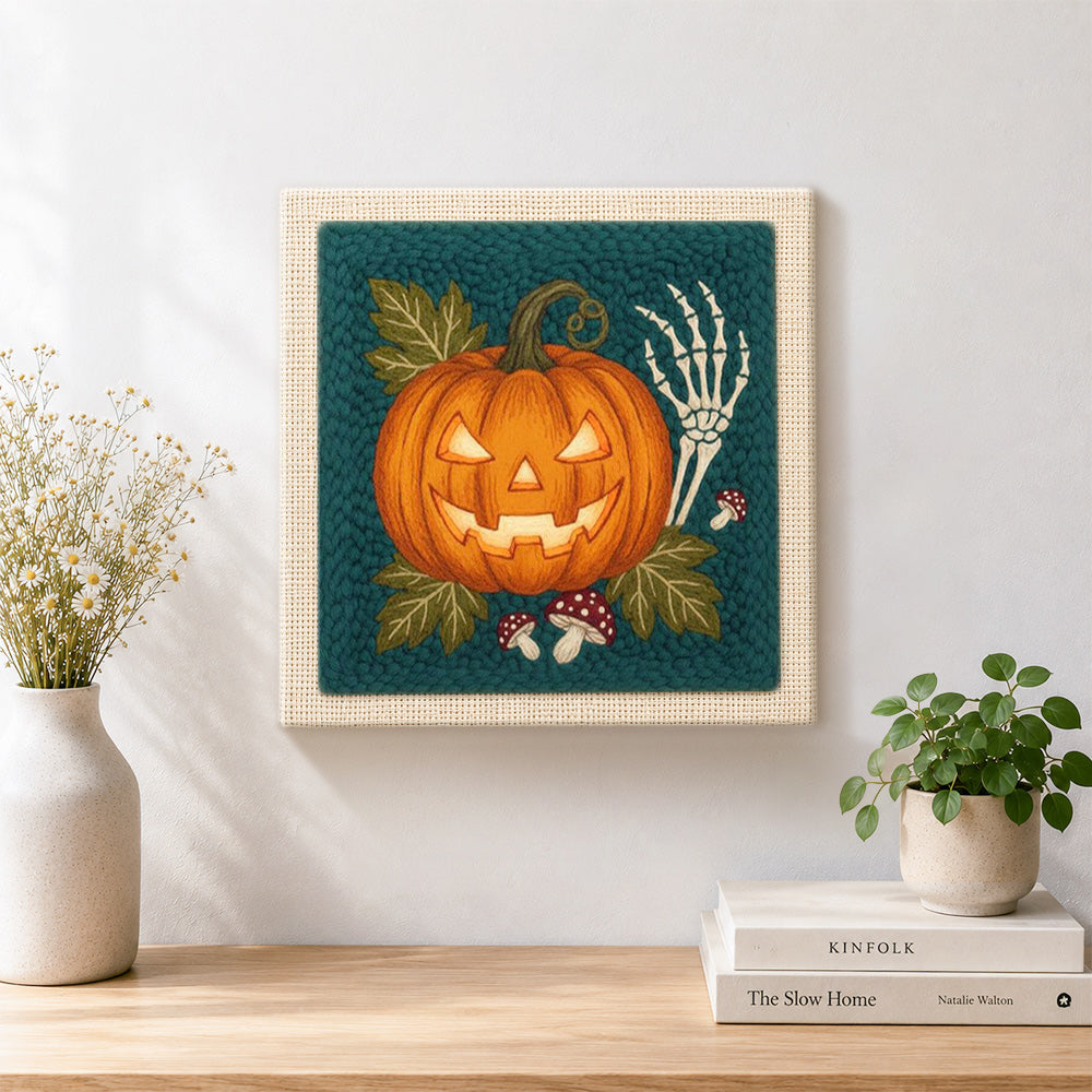 Finished glowing jack o lantern artwork displayed on a wall