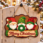 Gnomes with wreath paint by numbers door hanger on a garden gate