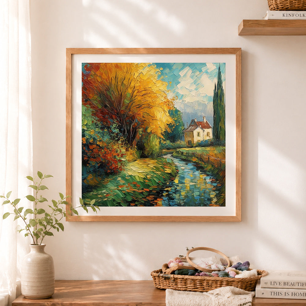 Finished golden autumn tree by the stream cross stitch artwork displayed as home decor