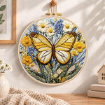 Golden butterfly with daisies embroidery hoop wall art displayed as warm and cozy handmade home decor