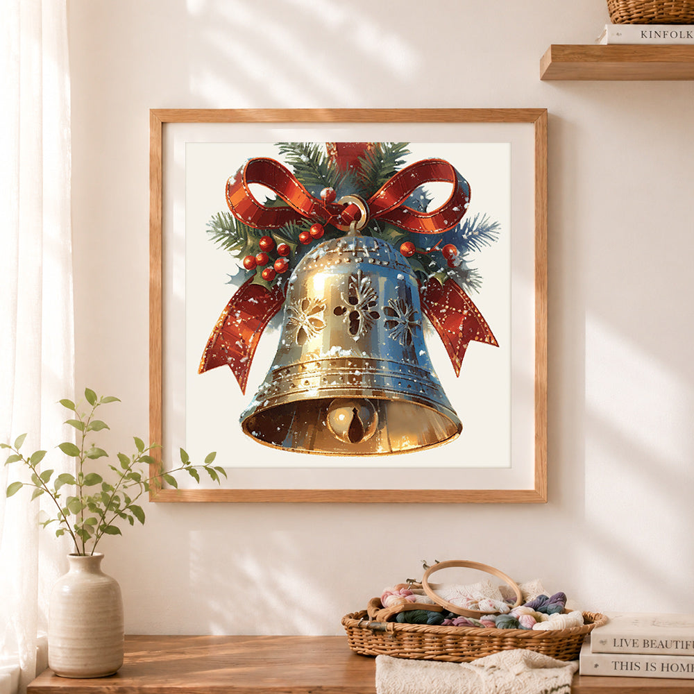 Finished golden christmas bell cross stitch artwork displayed as home decor