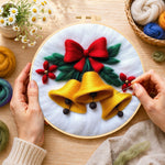 Creating the golden christmas bells with red bow wool painting by hand with a felting needle