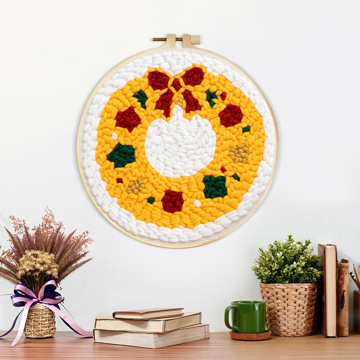 Finished golden christmas wreath artwork displayed on a wall