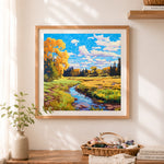 Finished golden creek meadow landscape cross stitch artwork displayed as home decor