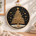 Golden festive tree embroidery hoop wall art displayed as warm and cozy handmade home decor