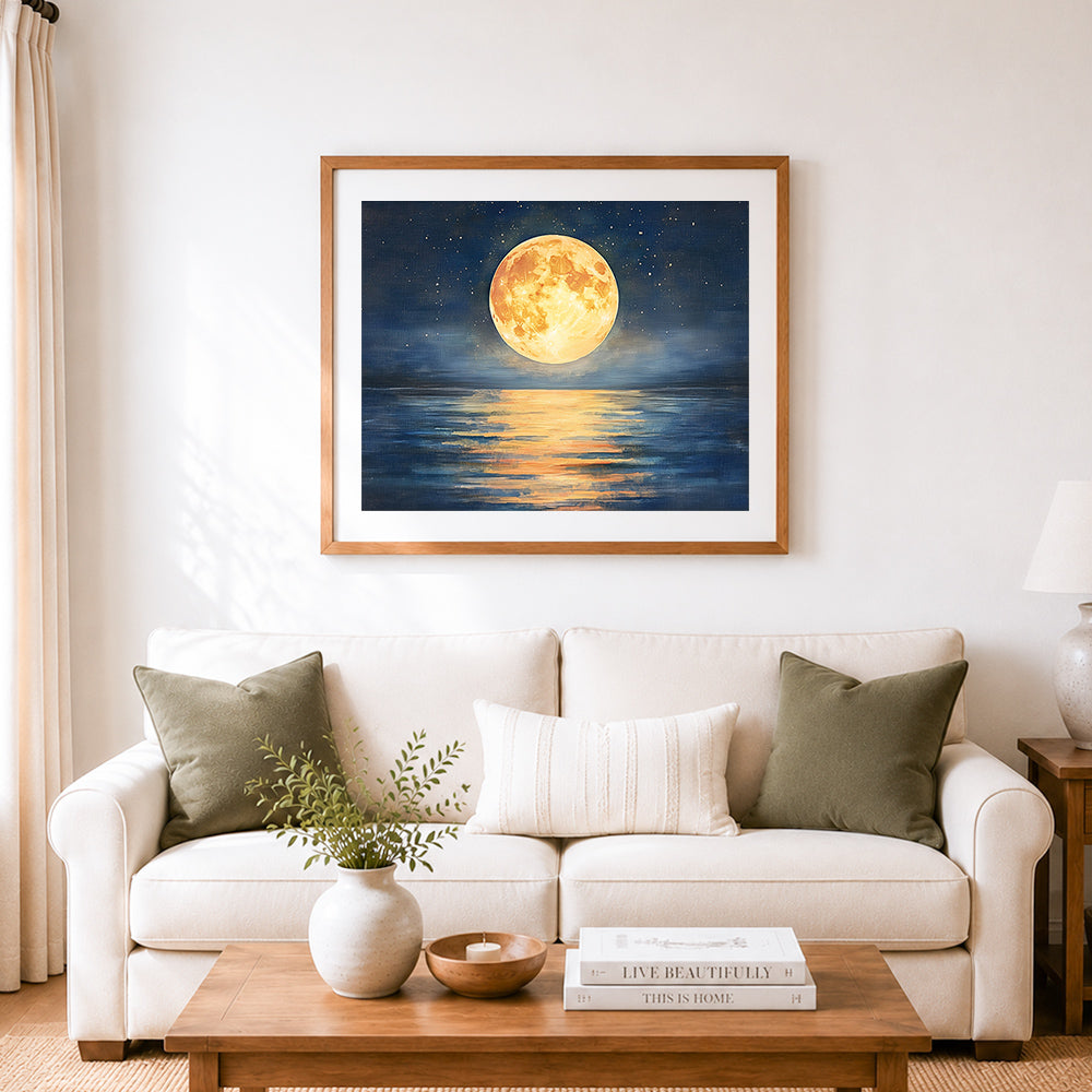 Finished golden full moon reflecting on deep ocean cross stitch artwork displayed as home decor
