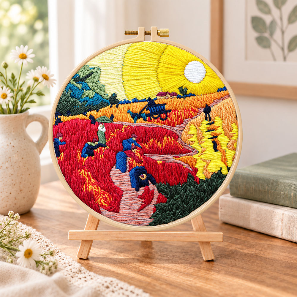 Golden harvest field sunset embroidery kit finished hoop displayed on a wooden stand as cozy tabletop decor