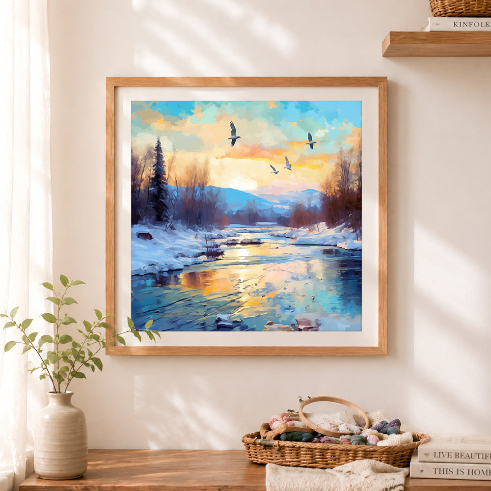 Finished golden hour winter riverside birds cross stitch artwork displayed as home decor