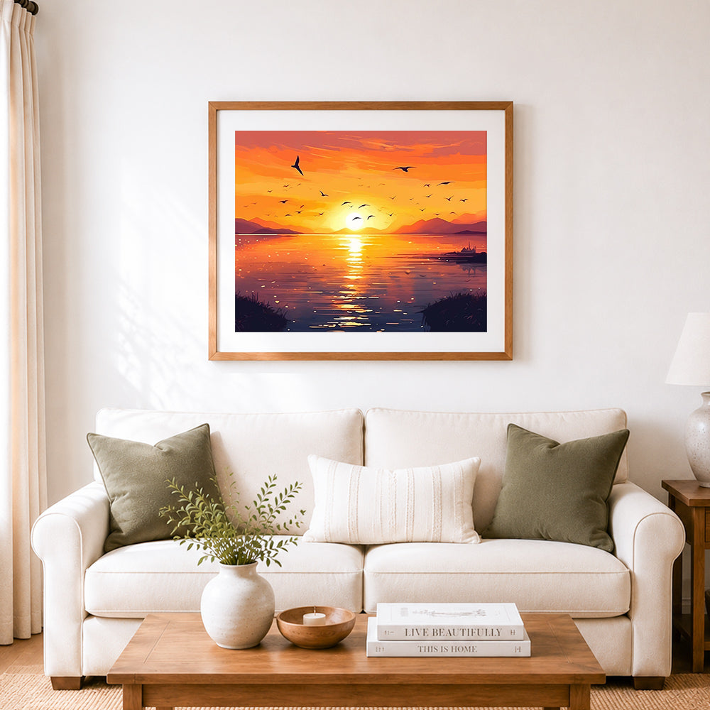 Finished golden lakeside sunset cross stitch artwork displayed as home decor