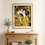 Finished golden lovers kiss cross stitch artwork displayed as home decor