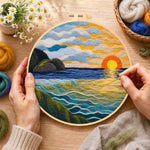 Creating the golden sunset and textured rolling waves wool painting by hand with a felting needle