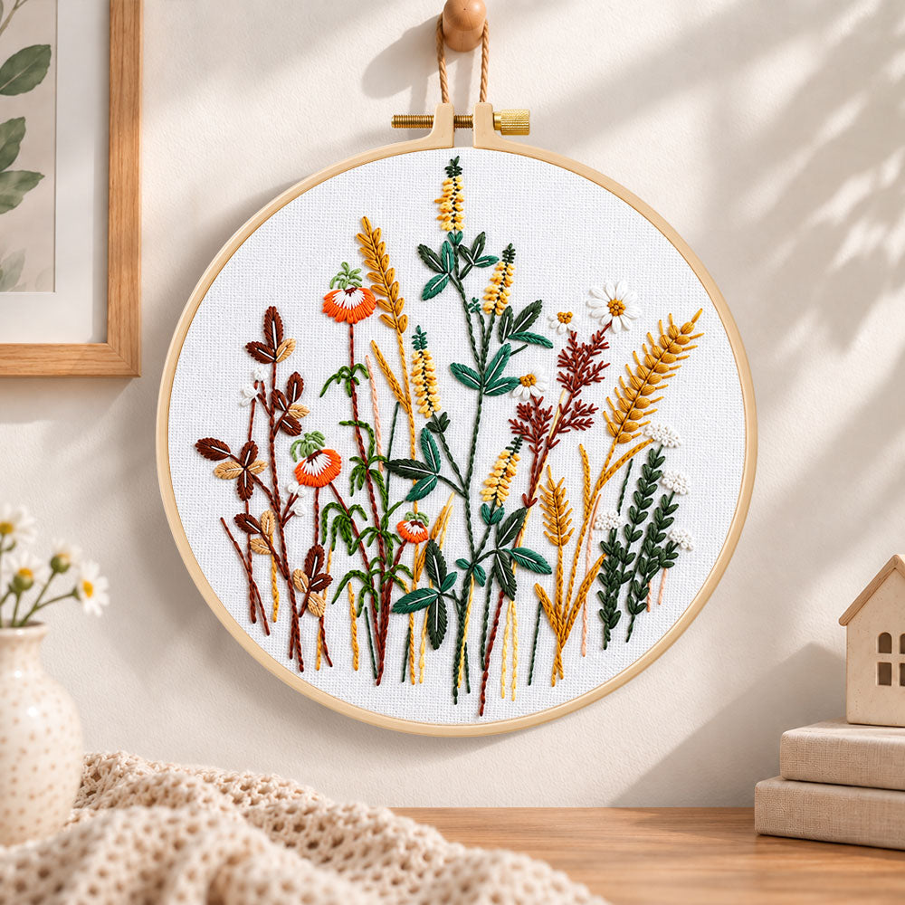 Golden wheat and poppy blooms embroidery hoop wall art displayed as warm and cozy handmade home decor