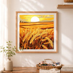Finished golden wheat field at sunset cross stitch artwork displayed as home decor