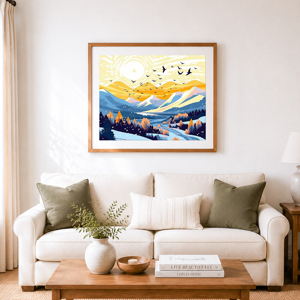 Finished golden winter mountain valley cross stitch artwork displayed as home decor
