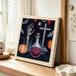 Gothic halloween potion scene punch needle artwork displayed on a table
