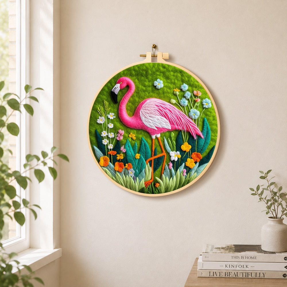 Graceful pink flamingo and wildflowers needle felt wall art displayed in a bright home interior