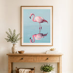Finished graceful pink flamingo cross stitch artwork displayed as home decor