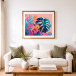 Finished gradient bright tropical foliage cross stitch artwork displayed as home decor