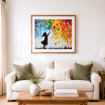 Finished graffiti-style girl with colorful heart balloons cross stitch artwork displayed as home decor