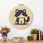 Finished gray kitten artwork displayed on a wall