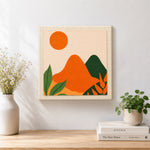Finished green and orange hills with leaves artwork displayed on a wall