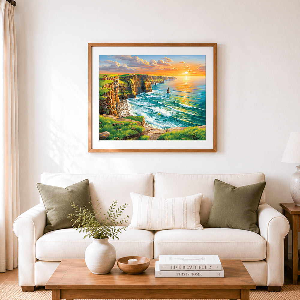 Finished green cliff seascape at golden sunset cross stitch artwork displayed as home decor
