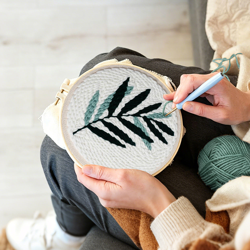 Creating handmade green fern leaf punch needle artwork