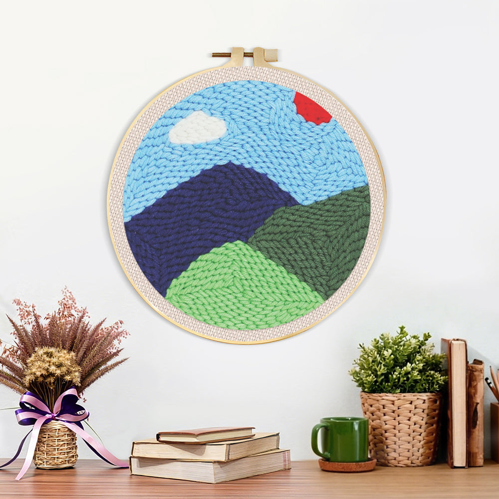 Finished green mountains in spring artwork displayed on a wall