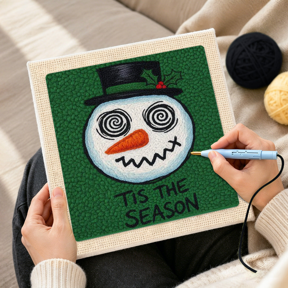 Creating handmade grinning spiral eye snowman punch needle artwork