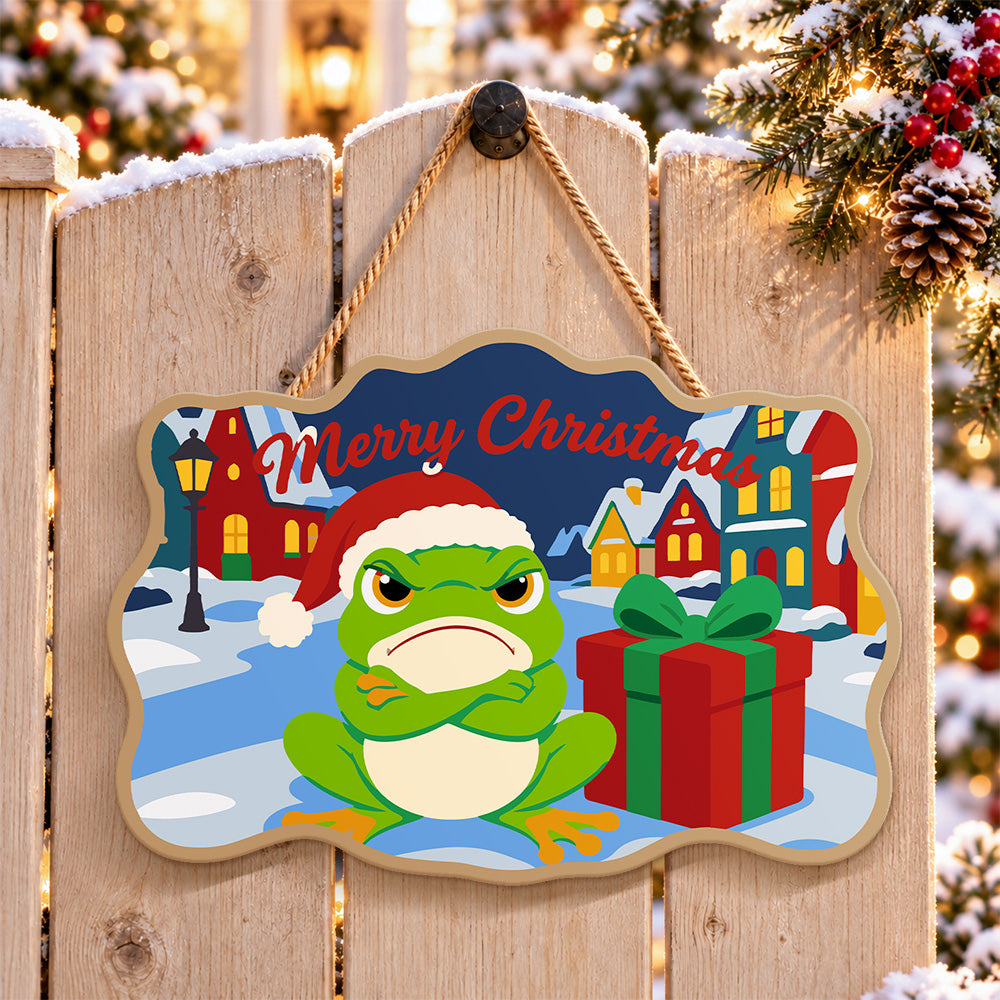 Grumpy frog christmas paint by numbers door hanger on a garden gate